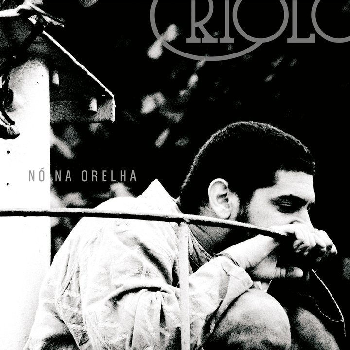 Criolo - Nó na Orelha - Tekst piosenki, lyrics | Tekściki.pl