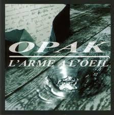 Opak (Groupe Belge) - L'arme à l’œil - Tekst piosenki, lyrics | Tekściki.pl