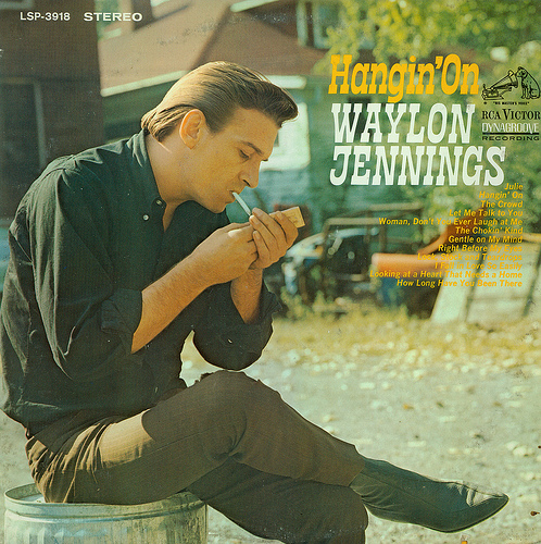 Waylon Jennings - Hangin' On - Tekst piosenki, lyrics | Tekściki.pl