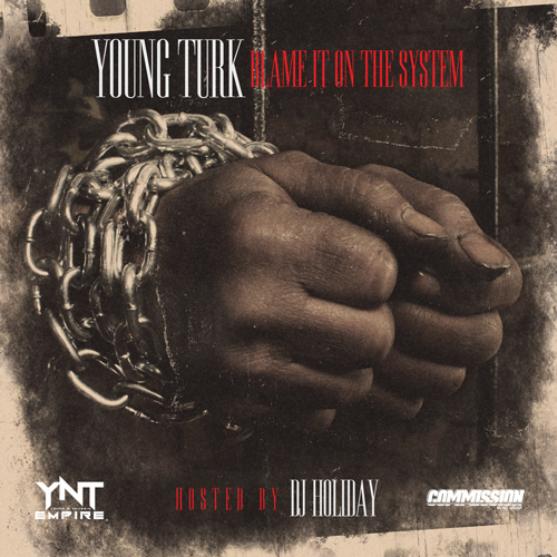 Turk - Blame It On The System - Tekst piosenki, lyrics - teksciki.pl
